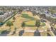 Aerial view showcasing a golf course and community with a winding path at 2524 S El Paradiso Dr # 74, Mesa, AZ 85202