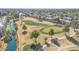 Aerial view of community, golf course, and waterway at 2524 S El Paradiso Dr # 74, Mesa, AZ 85202