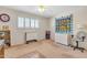 Bright bedroom with ceiling fan, built-in shelving and carpet flooring at 2524 S El Paradiso Dr # 74, Mesa, AZ 85202