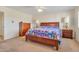 Main bedroom with wooden furniture and carpeted floor at 2524 S El Paradiso Dr # 74, Mesa, AZ 85202