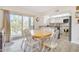 Casual dining area with wood table and chairs, open to kitchen and patio at 2524 S El Paradiso Dr # 74, Mesa, AZ 85202