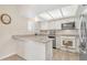 Well-equipped kitchen with granite countertops and white cabinets at 2524 S El Paradiso Dr # 74, Mesa, AZ 85202