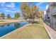 Tranquil waterway view alongside a residential building and golf course at 2524 S El Paradiso Dr # 74, Mesa, AZ 85202