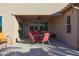 Covered patio with table and chairs, perfect for relaxing at 2605 E San Thomas Dr, Casa Grande, AZ 85194