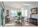 Bright dining area with glass table and four chairs, near sliding door at 2605 E San Thomas Dr, Casa Grande, AZ 85194