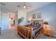 Spacious bedroom, featuring a log bed frame and ensuite bathroom access at 2622 E Marcos Dr, Casa Grande, AZ 85194