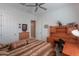 Spacious bedroom with wood furniture and ceiling fan at 2622 E Marcos Dr, Casa Grande, AZ 85194