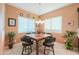 Charming breakfast nook with wood table and four leather chairs at 2622 E Marcos Dr, Casa Grande, AZ 85194