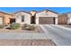 Charming curb appeal with a two-car garage and well-maintained landscaping at 2622 E Marcos Dr, Casa Grande, AZ 85194