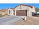 View of the home's garage and driveway from the street at 2622 E Marcos Dr, Casa Grande, AZ 85194