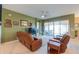 Spacious living room featuring leather recliners and backyard access at 2622 E Marcos Dr, Casa Grande, AZ 85194