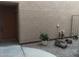 Front entry with wood door and small landscaped area at 2834 S Extension Rd # 1032, Mesa, AZ 85210