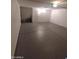 Attached garage with epoxy flooring and extra storage space at 2834 S Extension Rd # 1032, Mesa, AZ 85210