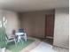 Small patio with table and chairs, artificial plants at 2834 S Extension Rd # 1032, Mesa, AZ 85210