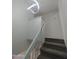 Modern staircase with gray carpeting and contemporary light fixture at 2834 S Extension Rd # 1032, Mesa, AZ 85210