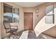 Inviting entryway with a brown door and patio seating at 29606 N Tatum Blvd # 216, Cave Creek, AZ 85331