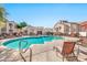 Community pool with lounge chairs at 29606 N Tatum Blvd # 216, Cave Creek, AZ 85331