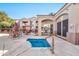 Community pool and spa with patio furniture and seating at 29606 N Tatum Blvd # 216, Cave Creek, AZ 85331