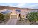 Single-story home with solar panels and desert landscaping at 30255 N 115Th Dr, Peoria, AZ 85383