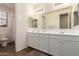 Elegant bathroom with double vanity and a shower at 30255 N 115Th Dr, Peoria, AZ 85383