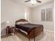 Cozy bedroom featuring a vintage bed frame and nightstand at 30255 N 115Th Dr, Peoria, AZ 85383