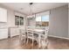 Bright dining room features a rustic farmhouse table with seating for six at 30255 N 115Th Dr, Peoria, AZ 85383