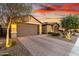 Well-maintained home with a two-car garage and desert landscaping at 30255 N 115Th Dr, Peoria, AZ 85383