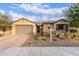 Beautiful home with a two-car garage and desert landscaping at 30255 N 115Th Dr, Peoria, AZ 85383