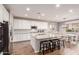 Modern kitchen featuring white cabinets, granite countertops, and an island at 30255 N 115Th Dr, Peoria, AZ 85383