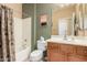 Bathroom with shower/tub combo and wood vanity at 30792 N Orange Blossom Cir, San Tan Valley, AZ 85143