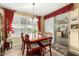 Bright dining area with wood table and chairs, access to kitchen and backyard at 30792 N Orange Blossom Cir, San Tan Valley, AZ 85143