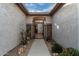 Charming entryway with a walkway, wrought iron gate, and desert landscaping at 30792 N Orange Blossom Cir, San Tan Valley, AZ 85143