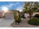 Front yard with cacti, shrubs, and a two-car garage at 30792 N Orange Blossom Cir, San Tan Valley, AZ 85143