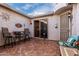 Outdoor patio with seating, tile flooring, and access to the kitchen at 30792 N Orange Blossom Cir, San Tan Valley, AZ 85143