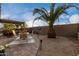 Relaxing patio area with seating and a large potted plant at 30792 N Orange Blossom Cir, San Tan Valley, AZ 85143