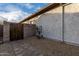 Landscaped side yard with walkway and metal art at 30792 N Orange Blossom Cir, San Tan Valley, AZ 85143