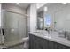 Contemporary bathroom with gray vanity and a walk-in shower at 33214 N 14Th St, Phoenix, AZ 85085