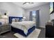 Comfortable bedroom with a plush velvet bed and modern nightstands at 33214 N 14Th St, Phoenix, AZ 85085