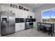 Modern kitchen with stainless steel appliances and white cabinets at 33214 N 14Th St, Phoenix, AZ 85085