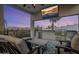 Outdoor kitchen and lounge area with TV at 33214 N 14Th St, Phoenix, AZ 85085