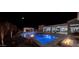 Night view of resort-style pool, spa, and fire features at 33214 N 14Th St, Phoenix, AZ 85085