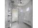 Spa-like shower with multiple shower heads and marble surround at 33214 N 14Th St, Phoenix, AZ 85085