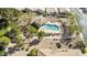 Community pool and spa with surrounding landscaping, viewed from above at 3324 E Maldonado Dr, Phoenix, AZ 85042