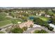 Aerial view of a golf course community with a clubhouse and lush green fairways at 3324 E Maldonado Dr, Phoenix, AZ 85042