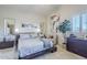 Spacious bedroom with a king-size bed and plenty of natural light at 3324 E Maldonado Dr, Phoenix, AZ 85042