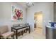 Breakfast nook with glass table and chairs, adjacent to laundry room at 3324 E Maldonado Dr, Phoenix, AZ 85042