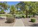 Walking path that winds through the community with lush landscaping at 3324 E Maldonado Dr, Phoenix, AZ 85042