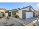 Single-story home with white exterior, gray accents, and landscaped yard at 3324 E Maldonado Dr, Phoenix, AZ 85042