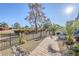 Landscaped front yard with walkway, mature trees, and desert landscaping at 3324 E Maldonado Dr, Phoenix, AZ 85042