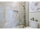 Large shower with tiled walls and built-in seat at 3324 E Maldonado Dr, Phoenix, AZ 85042